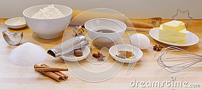 Baking gingerbread cookies for Christmas, ingredients and utilities on a wooden light worktop in the kitchen, panoramic format Stock Photo