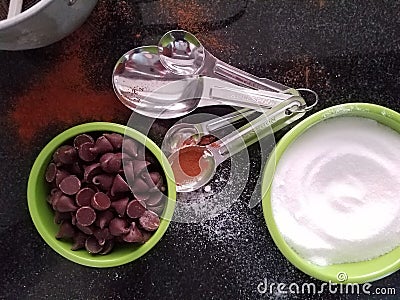 Time to bake - spilled sugar, chocolate morsels Stock Photo