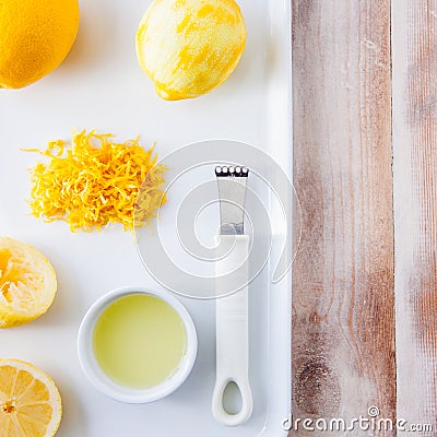 Baking ingredients for a lemon cake - whole lemon and lemon rind Stock Photo