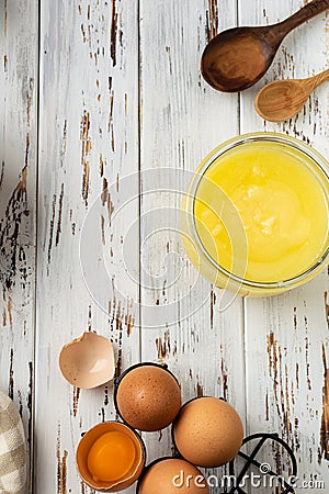 Baking pastry background vertical, ingredients, kitchen utensils on rustic wooden background Stock Photo