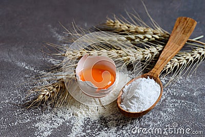 Baking powder in a wooden spoon Stock Photo