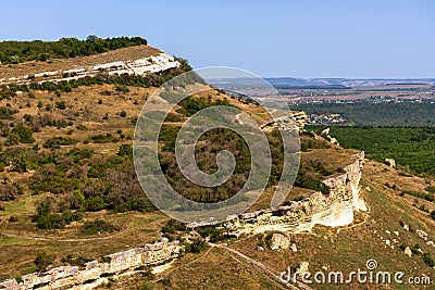 Bakla is an ancient cave town in Crimea. Scenic sunny day view of Bakla under blue sky Stock Photo