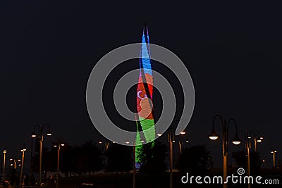 Flame Fountain building is illuminated by the colors of the Azerbaijan flag. Night view Editorial Stock Photo