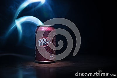 BAKU, AZERBAÄ°JAN - SEPTEMBER 15, 2019: Can of Dr Pepper soft drink on dark toned foggy background with light. Dr Pepper is a soft Editorial Stock Photo