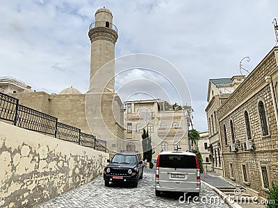 Baku, Azerbaijan, September, 10, 2019. Cars parked near Beyler Beylyar, Beglyar mosque of 1894-1895 years of construction, Ilya Editorial Stock Photo