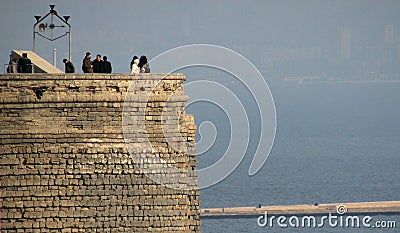 The Old Maiden Tower of Baku, Azerbaijan over the Caspian Sea Editorial Stock Photo