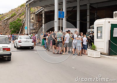 Balaklava, Sevastopol, Crimea - July 8, 2020: Long queue of tourists waiting to enter the historical museum. Editorial Stock Photo