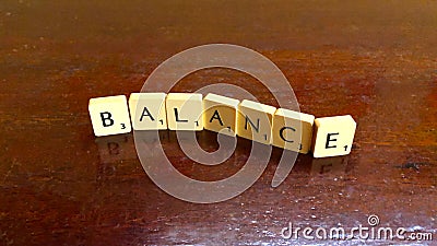 Balance word written on scrabble blocks for content creation Editorial Stock Photo