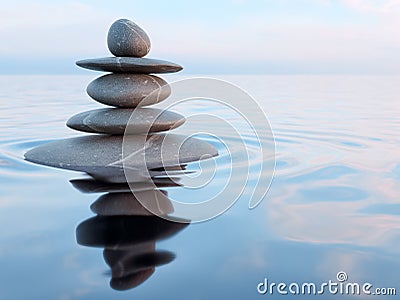 Balanced Zen stones in water Stock Photo