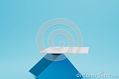 balancing on a blue cube white stand on a blue background. copy paste, copy space. 3D render Stock Photo