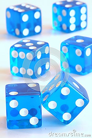 Balancing blue dice Stock Photo