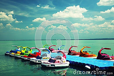 Balatonfured, June 02 2018, Children pedal boats moored at marina on the Balaton Lake Editorial Stock Photo