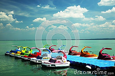 Balatonfured, June 02 2018. Children pedal boats moored at marina on the Balaton Lake Editorial Stock Photo