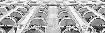 Balconies of a high-rise building. Bottom view. Architectural elements. Modern building in classic style. Multi-storey building. Stock Photo