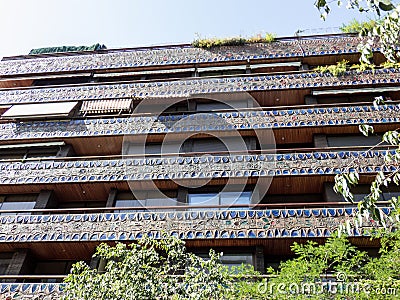 Balconies in a row on the facade of the urban historic building with ceramic ornament, Madrid, Spain Stock Photo