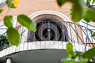 Balcony of brick country house Stock Photo