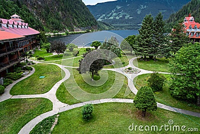 Balcony view of the Three Valley Lake Chateau with gardens overlooking the Selkirk Mountains. Editorial Stock Photo