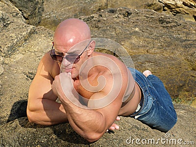 Bald man in sunglasses Stock Photo