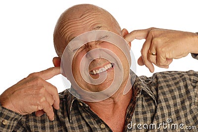 Bald senior man plugging ears Stock Photo