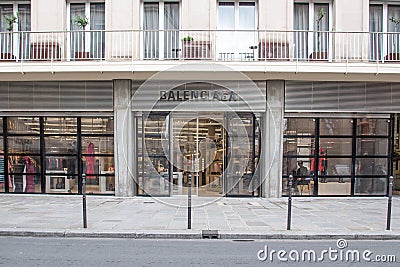 Balenciaga clothing brand store showcase and entrance area on "Rue saint Honore" in Paris Editorial Stock Photo