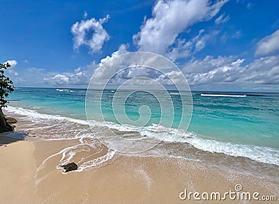 Tropical Tranquility: Bali's Sandy Shores and Shades of Teal Waters Stock Photo