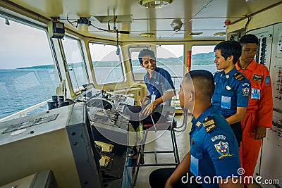 BALI, INDONESIA - APRIL 05, 2017: Ferry boat pilot command cabin with view on the sea with many assistants there in Ubud Editorial Stock Photo