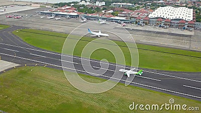 Bali, Indonesia, December 4, 2020. Aerial view of airplanes at the airport runway. Indonesian budget airline, Citylink plane Editorial Stock Photo