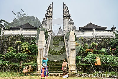 Tourists near the entrance to the Pura Lempuyang temple Editorial Stock Photo