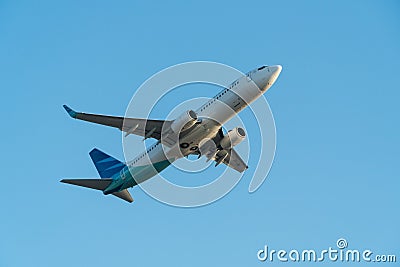 BALI/INDONESIA-JUNE 06 2019: Garuda Indonesia, one of the airlines in Indonesia which join the sky team, is flying over the blue Editorial Stock Photo