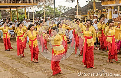 Beautiful indonesian people group in colorful sarongs - traditional Balinese style ethnic dancer costumes at Bali Arts and Editorial Stock Photo