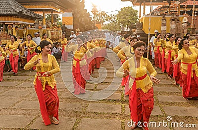 Beautiful indonesian people group in colorful sarongs - traditional Balinese style ethnic dancer costumes at Bali Arts and Editorial Stock Photo