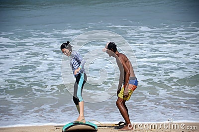 People learning surfing on the Balinese beach Editorial Stock Photo