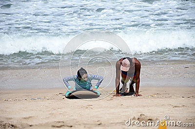 People learning surfing on the Balinese beach Editorial Stock Photo