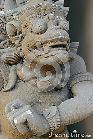 Bali, Indonesia. 8 OCT 2018. Scary looking traditional Bali island stone sculpture covered with beige dust Editorial Stock Photo