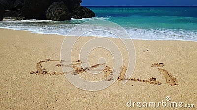 Bali written in sand on beach Stock Photo