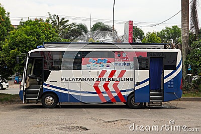 Balikpapan, Indonesia - August 9th, 2021: Indonesian Police mobile bus office for driving license renewal service. Editorial Stock Photo