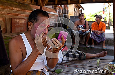 Balinese actor preparing for a dance Barong Editorial Stock Photo