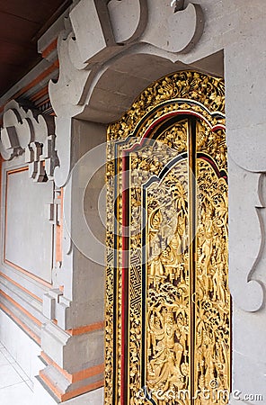 Balinese Carved House Interior, Golden door Stock Photo