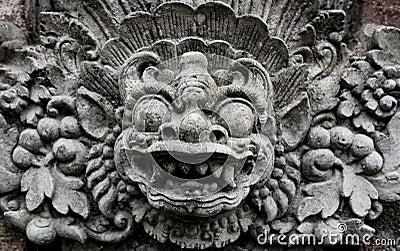 Balinese demon carved in stone Stock Photo