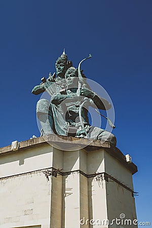 Balinese hindu statue over the blue sky Stock Photo