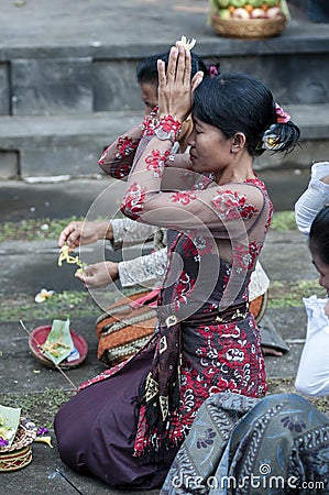 Balinese pray at temple Editorial Stock Photo