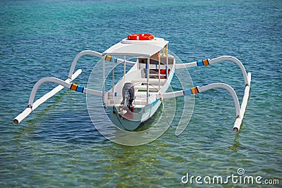 Balinese traditional boat with motor - double outrigger jukung Stock Photo