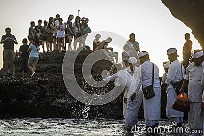 Balinese traditional ceremony at Old Tanah Lot temple Editorial Stock Photo