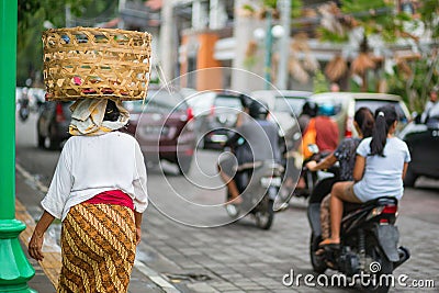 Balinese woman on a street of Ubud Editorial Stock Photo