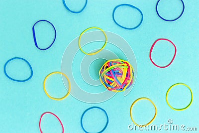 Ball or knot of thin multicolored elastic band rubbers. Tangle of thoughts Stock Photo