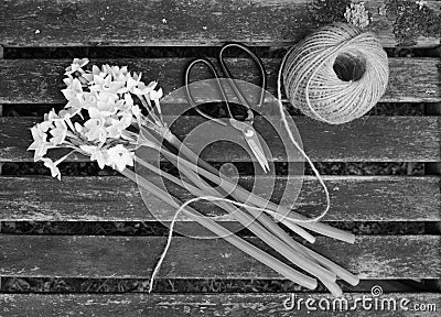 Ball of twine and scissors with bunch of white narcissi Stock Photo