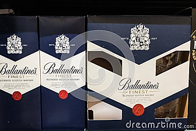 Ballantines Finest logo on some bottles for sales. Editorial Stock Photo