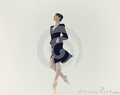 ballerina in a black dress moves sexually on her fingers Stock Photo