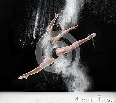 Ballerina dancing with flour, jump Stock Photo