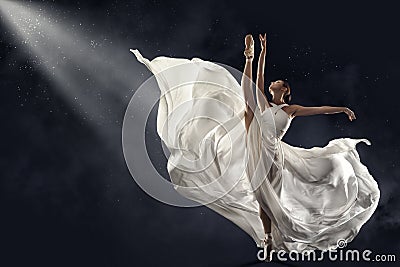 Ballerina Jumping in White Silk Dress, Modern Ballet Dancer in Pointe Shoes, Fluttering Waving Cloth, Gray Background Stock Photo